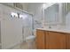 This bathroom features a walk-in shower with glass door and a window for natural light at 695 Rivendell Blvd, Osprey, FL 34229