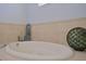 Bathroom featuring soaking tub with jets and beachy decorative accents at 695 Rivendell Blvd, Osprey, FL 34229