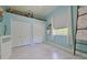 This bedroom has a cool color scheme and is decorated with vintage collectibles at 695 Rivendell Blvd, Osprey, FL 34229