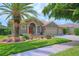 Inviting home featuring lush landscaping, a barrel tile roof, and a spacious three-car garage at 695 Rivendell Blvd, Osprey, FL 34229