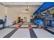 View of a well-organized garage showcasing stylish flooring and a clean, clutter-free environment at 695 Rivendell Blvd, Osprey, FL 34229