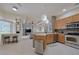 Bright eat-in kitchen features wooden cabinets and stainless steel appliances at 695 Rivendell Blvd, Osprey, FL 34229