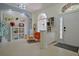 Bright living room featuring a vintage decor, high ceilings, arched transom windows, and tile floors at 695 Rivendell Blvd, Osprey, FL 34229