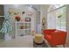 Bright living room showcasing vintage decor, tile floors, transom window, and comfortable seating at 695 Rivendell Blvd, Osprey, FL 34229