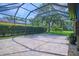 Screened in patio with beautiful brickwork at 695 Rivendell Blvd, Osprey, FL 34229