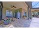 Covered patio with brick flooring, ceiling fan, and outdoor storage at 695 Rivendell Blvd, Osprey, FL 34229