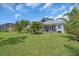 Expansive backyard with well-kept lawn, patio and lush landscaping perfect for outdoor living at 7026 43Rd E Ave, Palmetto, FL 34221