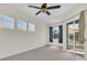 Light-filled bedroom features sliding glass door access to the outdoors and multiple windows at 7026 43Rd E Ave, Palmetto, FL 34221