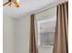 Bedroom with curtains, ceiling fan, and window with blinds at 7026 43Rd E Ave, Palmetto, FL 34221