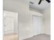 Spacious bedroom with adjacent open doors and tiled flooring at 7026 43Rd E Ave, Palmetto, FL 34221