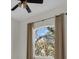 Bedroom featuring a window with curtains and a ceiling fan with lights at 7026 43Rd E Ave, Palmetto, FL 34221