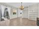 Bright dining room features sliding glass doors and ample natural light, complete with a decorative chandelier at 7026 43Rd E Ave, Palmetto, FL 34221