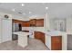 Well-lit kitchen with stainless steel appliances, wood cabinets, and a functional center island at 7026 43Rd E Ave, Palmetto, FL 34221
