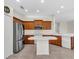 Bright kitchen featuring stainless steel appliances, modern white counters, and a convenient island at 7026 43Rd E Ave, Palmetto, FL 34221