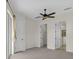 Spacious main bedroom featuring multiple closets and convenient en-suite bath access at 7026 43Rd E Ave, Palmetto, FL 34221