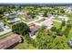 An aerial view of the property showing its location, roof and surrounding greenery at 7164 Gama Ct, North Port, FL 34287