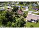 Aerial view of the home showing surrounding neighborhood and lush backyard at 7164 Gama Ct, North Port, FL 34287