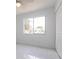 Bright bedroom with large windows, neutral walls, and tile flooring at 7164 Gama Ct, North Port, FL 34287