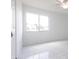Clean bedroom with window, tile floors, ceiling fan, and closet at 7164 Gama Ct, North Port, FL 34287