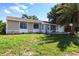 Well-maintained single-story home with a lush green lawn, impact windows, and inviting curb appeal at 7164 Gama Ct, North Port, FL 34287