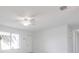 Spacious living area with modern ceiling fan, an entry door, neutral paint and ample natural light at 7164 Gama Ct, North Port, FL 34287