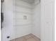 Well-organized pantry with wire shelving and tile floor offers ample storage space at 7164 Gama Ct, North Port, FL 34287