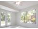 Bright room with large windows and French doors leading to the backyard at 7164 Gama Ct, North Port, FL 34287