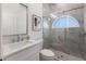 Clean bathroom features a large vanity with stone countertop and tiled shower with glass doors at 7211 Marston Ct, University Park, FL 34201