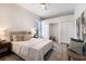 Comfortable bedroom with a large bed, neutral colors, and well-placed decorative pillows at 7211 Marston Ct, University Park, FL 34201