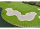 Scenic golf course with a large sand bunker and lush green grass bordering a pond at 7211 Marston Ct, University Park, FL 34201