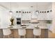 Modern kitchen with stainless steel appliances, marble countertops, and a spacious center island at 7211 Marston Ct, University Park, FL 34201