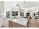 Spacious kitchen features a large island, stainless appliances, and an open layout flowing into the living area at 7211 Marston Ct, University Park, FL 34201
