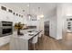 Bright, open kitchen with a large island, stainless steel appliances, and ample cabinet space at 7211 Marston Ct, University Park, FL 34201