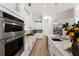 Well-equipped kitchen featuring stainless steel appliances, ample counter space, and modern white cabinetry at 7211 Marston Ct, University Park, FL 34201