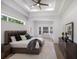 Relaxing main bedroom with tray ceiling and cozy window nook perfect for relaxation and reading at 7211 Marston Ct, University Park, FL 34201