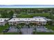 Aerial view of condos overlooking a golf course and pond, with one circled in red at 7301 W. Country Club N Dr # 108, Sarasota, FL 34243