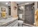 Bathroom with a shower, sink with vanity, toilet and decor at 7301 W. Country Club N Dr # 108, Sarasota, FL 34243
