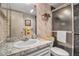Bathroom with a shower, sink with vanity, toilet and decor at 7301 W. Country Club N Dr # 108, Sarasota, FL 34243