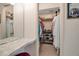 Walk-in closet with built-in shelving, vanity area, and ample storage space for clothes and accessories at 7301 W. Country Club N Dr # 108, Sarasota, FL 34243