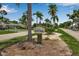 Exterior view of community sign for Palm Aire Golf Side, showing trees and landscaping at 7301 W. Country Club N Dr # 108, Sarasota, FL 34243
