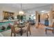Inviting dining room featuring a dining area, mirror, and stylish decor at 7301 W. Country Club N Dr # 108, Sarasota, FL 34243