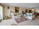 Comfortable living room showcasing stylish sofas, a decorative rug, and bright natural light at 7301 W. Country Club N Dr # 108, Sarasota, FL 34243