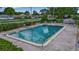 Enjoy the refreshing community pool, complete with ample seating and beautifully landscaped surroundings at 7301 W. Country Club N Dr # 108, Sarasota, FL 34243
