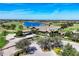 Aerial view of the attractive community clubhouse with golf course and lake views at 7605 Haddington Cv, Lakewood Ranch, FL 34202