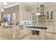 A gourmet kitchen with granite countertops, stainless steel appliances, and custom cabinetry providing both beauty and functionality at 7605 Haddington Cv, Lakewood Ranch, FL 34202