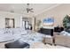 Expansive living room features neutral decor, tile floors, and an inviting seating arrangement at 7605 Haddington Cv, Lakewood Ranch, FL 34202