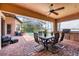 Outdoor patio with brick flooring, ceiling fan, a built-in grill, and a view of the pool at 7605 Haddington Cv, Lakewood Ranch, FL 34202