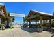 Anna Maria City Pier, a charming waterfront entrance with covered seating, inviting visitors to stroll along the picturesque shoreline at 8009 20Th W Pl, Bradenton, FL 34209