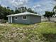 Exterior of a single-Gathering home with a metal roof and well-maintained lawn at 811 24Th Street E Ct, Bradenton, FL 34208