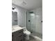 Bathroom with sleek glass shower with marble tile and modern fixtures at 811 24Th Street E Ct, Bradenton, FL 34208